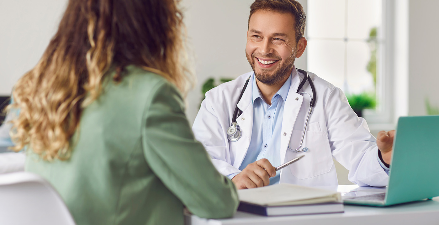 Doctor consulting with patient in-office check up.